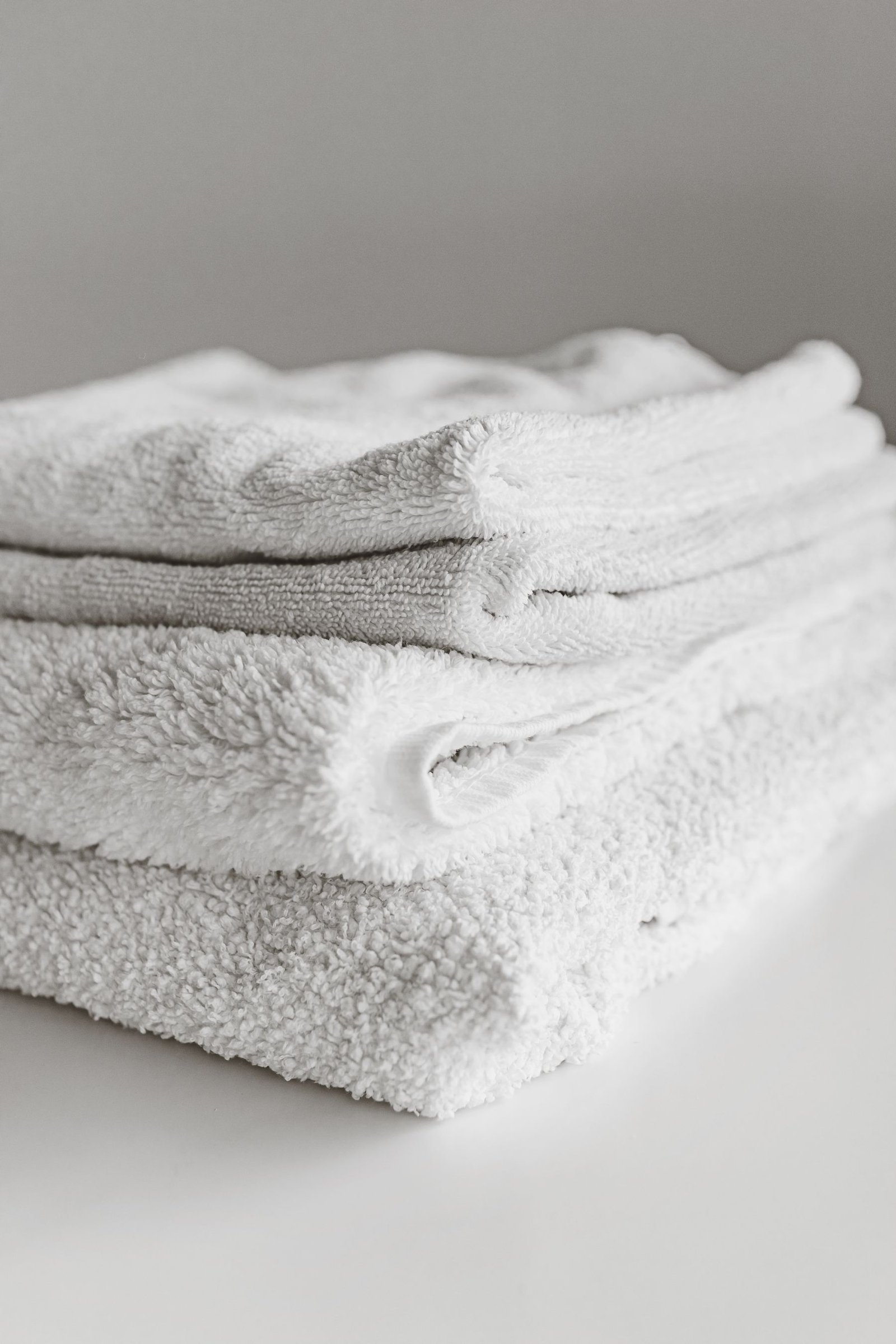 Close view of neatly folded white towels